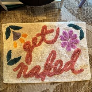 Urban Outfitters “get naked” floral bathmat